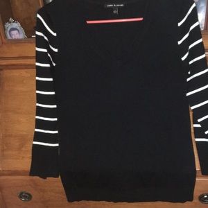 Black long sleeve sweater with striped sleeves